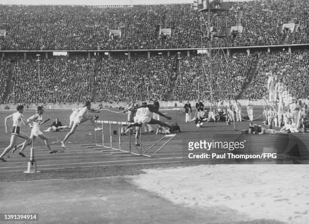 American athlete Fritz Pollard clips the last hurdle of the men's 110-metres hurdles event of the 1936 Summer Olympics, held in the Olympiastadion in...