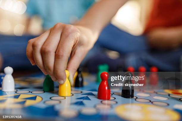 close up of playing ludo game. - pawn chess piece stock pictures, royalty-free photos & images