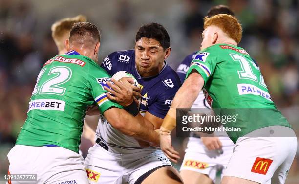 Jason Taumalolo of the Cowboys is tackled during the round six NRL match between the Canberra Raiders and the North Queensland Cowboys at GIO Stadium...