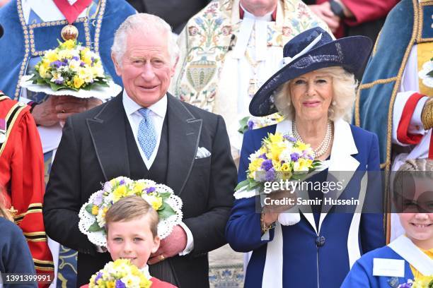 Camilla, Duchess of Cornwall and Prince Charles, Prince of Wales hold nosegays as they attend the Royal Maundy Service at St George's Chapel on April...