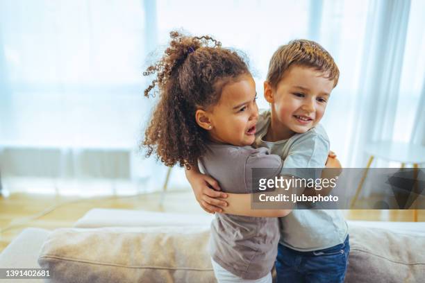 we love eachother so much - brother hug stock pictures, royalty-free photos & images
