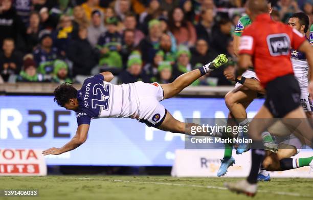 Jeremiah Nanai of the Cowboys socres a try during the round six NRL match between the Canberra Raiders and the North Queensland Cowboys at GIO...