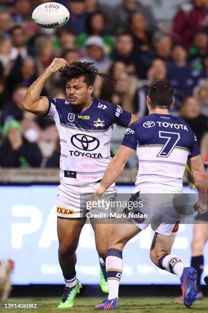 Jeremiah Nanai of the Cowboys celebrates scoring a try with team mates during the round six NRL match between the Canberra Raiders and the North...