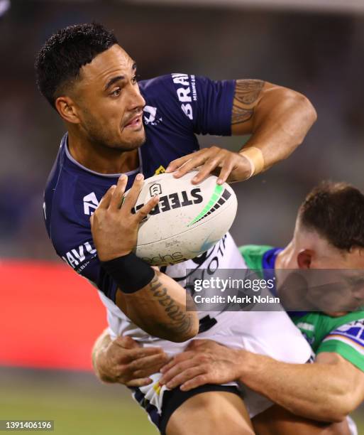 Valentine Holmes of the Cowboys offloads during the round six NRL match between the Canberra Raiders and the North Queensland Cowboys at GIO Stadium...