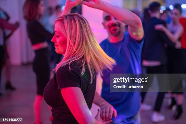 dancing salsa at the party - salsa dancing stockfoto's en -beelden