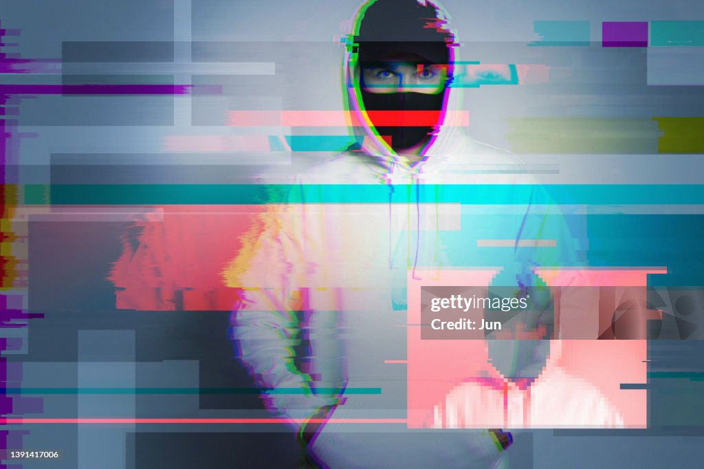 Creative image with anonymous hacker with glitch and interference effects