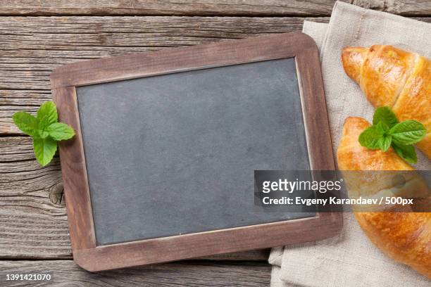 blackboard for your text and croissants - kreide tafel kräuter stock-fotos und bilder