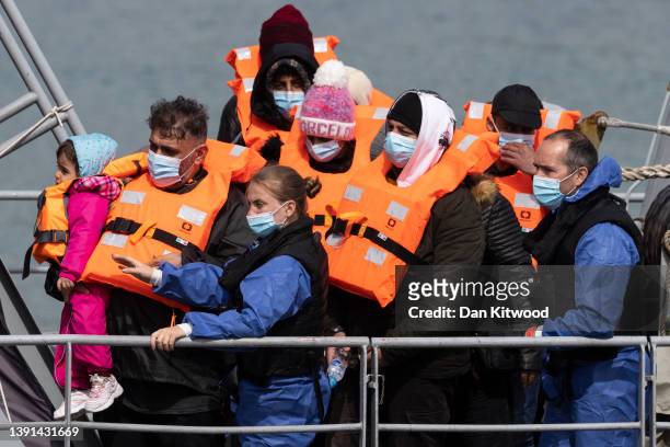 Migrants arrive at Dover port after being picked up in the channel by the border force on April 14, 2022 in Dover, England. The UK government...