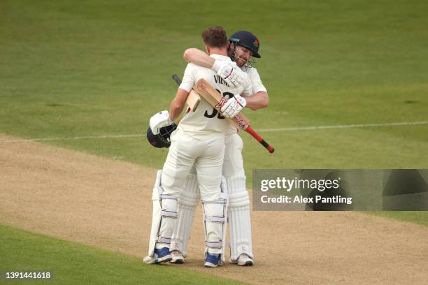 Dane Vilas of Lancashire celebrates making 100 with team mate Steven Croft during the LV= Insurance County Championship match between Kent and...