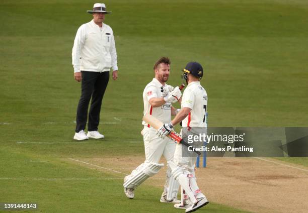 Steven Croft of Lancashire ceelebrates making 100 with team mate Phil Salt during the LV= Insurance County Championship match between Kent and...