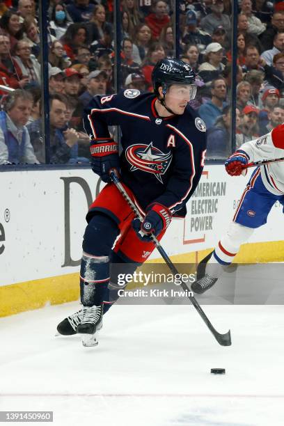 Zach Werenski of the Columbus Blue Jackets controls the puck during the game against the Montreal Canadiens at Nationwide Arena on April 13, 2022 in...