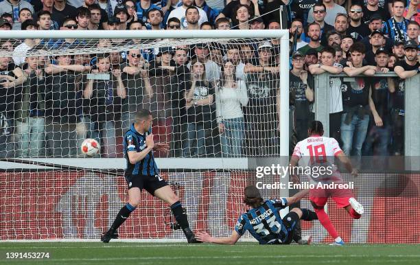 Christopher Nkunku of RB Leipzig scores their team's first goal during the UEFA Europa League Quarter Final Leg Two match between Atalanta and RB...