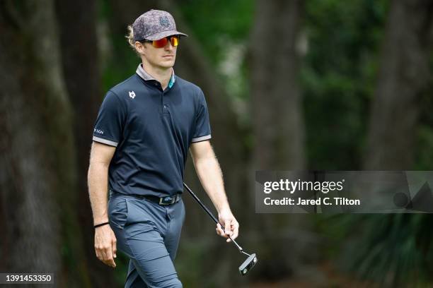 Morgan Hoffmann walks to the first green during the first round of the RBC Heritage at Harbor Town Golf Links on April 14, 2022 in Hilton Head...