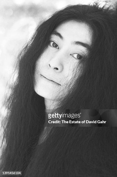 Artist, composer, and singer Yoko Ono, poses for a portrait on November 11, 1974 at her home at the Dakota apartment building in New York City, New...