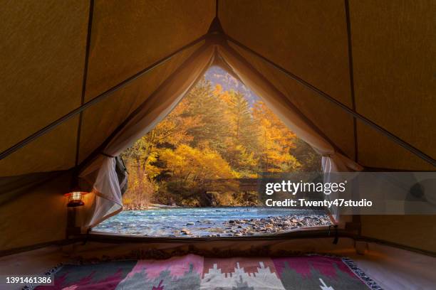 autumn landscape view from inside the tent at kamikochi, japan - inside of a bank stock pictures, royalty-free photos & images