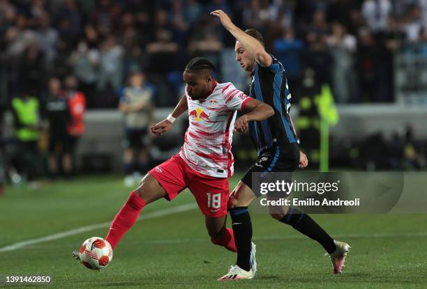 Christopher Nkunku of RB Leipzig is challenged by Teun Koopmeiners of Atalanta BC during the UEFA Europa League Quarter Final Leg Two match between...