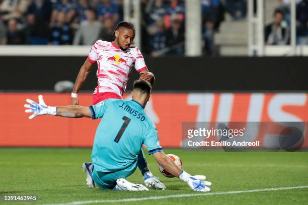 Christopher Nkunku of RB Leipzig is fouled by Juan Musso of Atalanta BC which leads to a penalty for RB Leipzig during the UEFA Europa League Quarter...