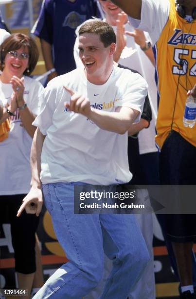 Forward Mark Madsen of the Los Angeles Lakers entertains the thousands of fans gathered for the Lakers championship victory rally with a dance in Los...