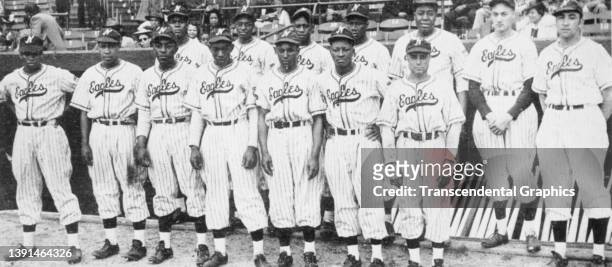 Portrait of members of the Newark Eagles baseball team, of the National Negro League, as they pose before a game at Ruppert Stadium, Newark, New...