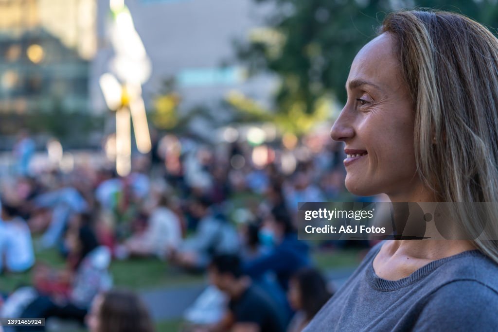 Woman attending an outdoor show.