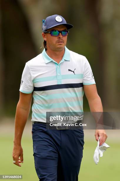 Rickie Fowler walks across the 15th hole during the first round of the RBC Heritage at Harbor Town Golf Links on April 14, 2022 in Hilton Head...