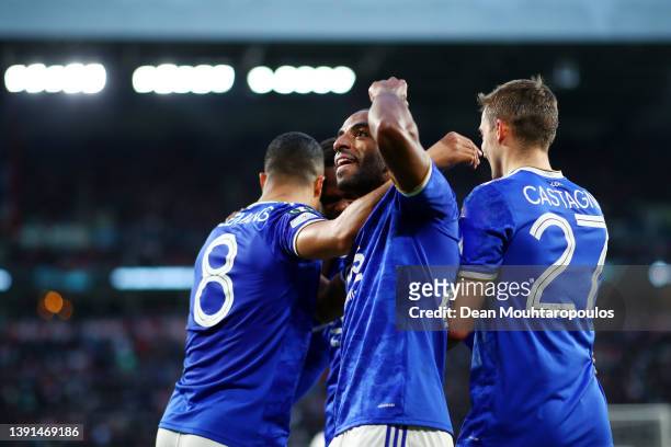 Ricardo Pereira of Leicester City celebrates with teammates Youri Tielemans and Timothy Castagne after scoring their team's second goal during the...