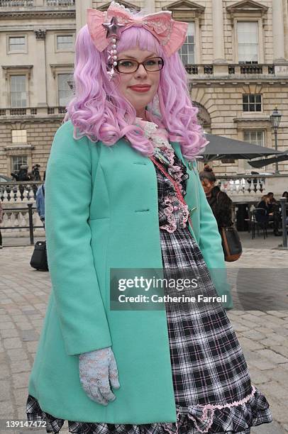 Florrie Clarke wearing Oasis Jacket, Bodyline Dress, Vivienne Westwood Bag, Luella Shoes, Gothic Lolita Wig, Handmade Necklace and Fendi Glasses at...