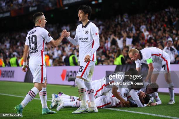 Rafael Santos Borre and Daichi Kamada of Eintracht Frankfurt celebrate after Filip Kostic of Eintracht Frankfurt scores their sides third goal during...