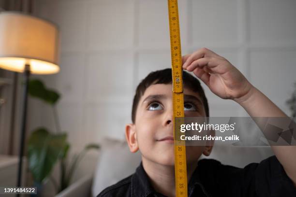 concept of development, growing up. - kids growth chart stock pictures, royalty-free photos & images