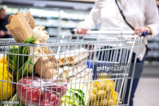 shopping mall - groceries - shopping trolleys stock pictures, royalty-free photos & images