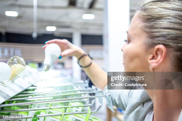 woman in a  shopping mall - energy efficient lightbulb bildbanksfoton och bilder