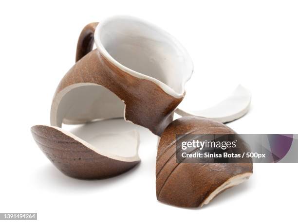 broken ceramics,close-up of sunglasses on white background - broken vase stock pictures, royalty-free photos & images