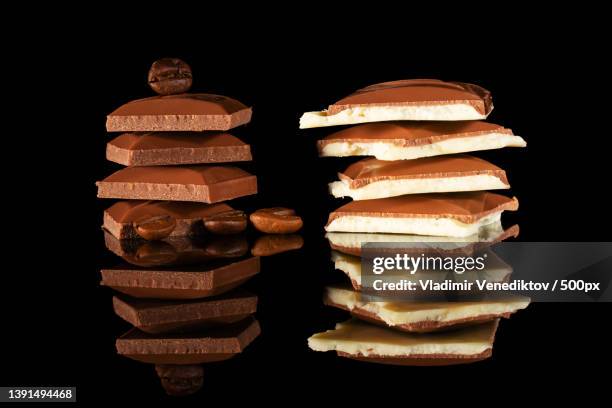 pieces of milk and white chocolate - broken coffee bean stock pictures, royalty-free photos & images