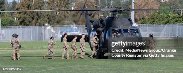 April 14: ROTC cadets board a Black Hawk UH-60M helicopter during a Military Exhibition Day at Cal State Fullerton in Fullerton, CA on Thursday,...