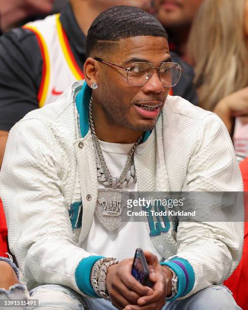 Rapper, Nelly attends the game between the Charlotte Hornets and Atlanta Hawks at State Farm Arena on April 13, 2022 in Atlanta, Georgia. NOTE TO...