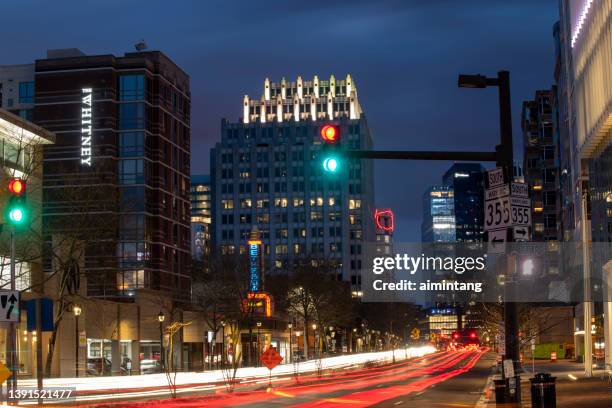 night traffic in downtown bethesda - downtown bethesda stock pictures, royalty-free photos & images