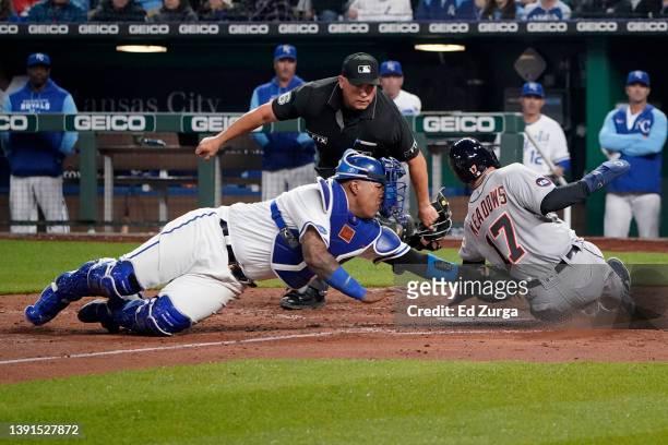 Austin Meadows of the Detroit Tigers is tagged out by Salvador Perez of the Kansas City Royals as he tries to score on a Miguel Cabrera single in the...