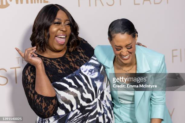 Loni Love and Tia Mowry arrive at Showtime's FYC event and premiere for 'The First Lady' at DGA Theater Complex on April 14, 2022 in Los Angeles,...