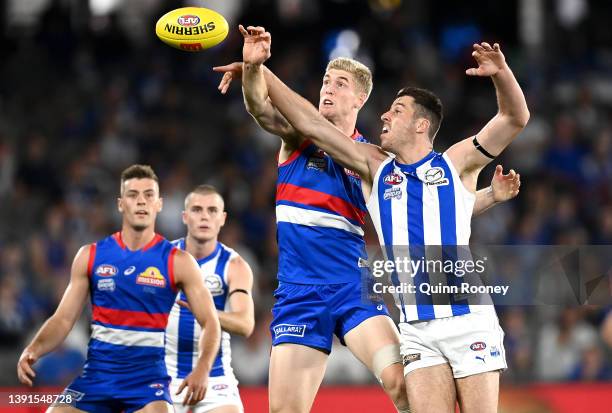 Tim English of the Bulldogs and Tristan Xerri of the Kangaroos compete in the ruck during the round five AFL match between the North Melbourne...