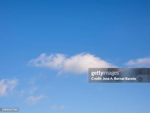 full frame of the blue sky and white clouds. - high noon stock-fotos und bilder