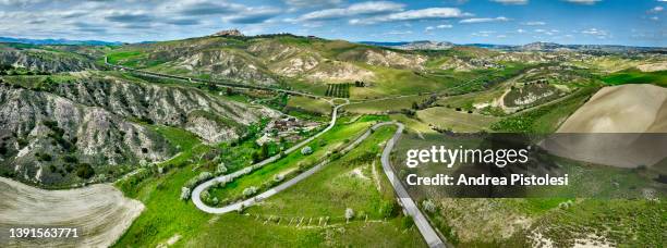 the ghost village of craco in basilicata, italy - badlands stock-fotos und bilder