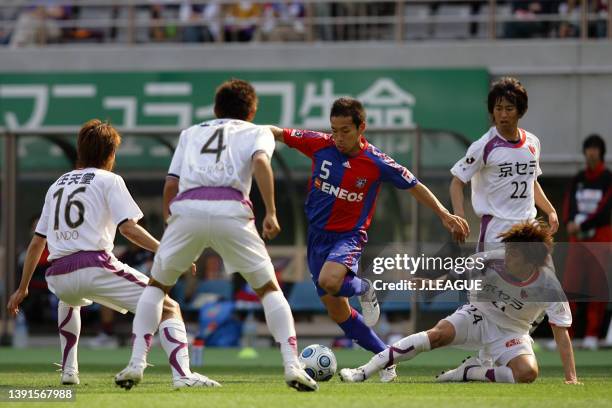 Yuto Nagatomo of FC Tokyo competes for the ball against Kyoto Sanga defense during the J.League J1 match between FC Tokyo and Kyoto Sanga at...