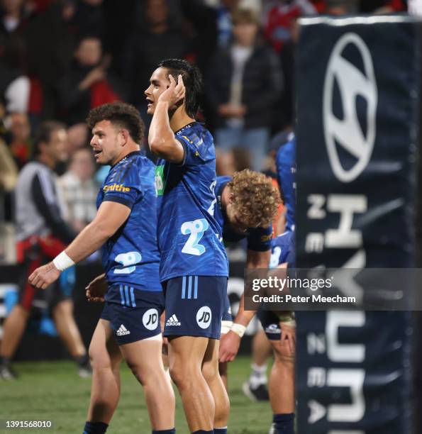 Ricky Riccitelli, left, and Zarn Sullivan from the Blues react to the crowd after the final whistle during the round four Super Rugby Pacific match...