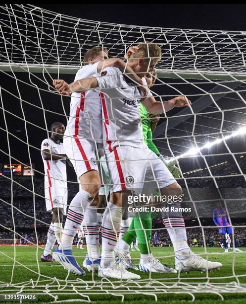 Eintracht Frankfurt players celebrate with his team mate Martin Hinteregger of Eintracht Frankfurt after he cleared the ball over the goal line...