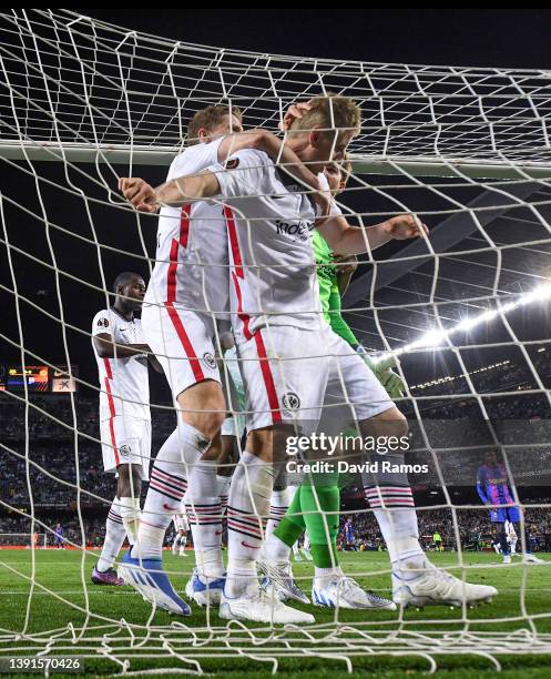 Eintracht Frankfurt players celebrate with his team mate Martin Hinteregger of Eintracht Frankfurt after he cleared the ball over the goal line...