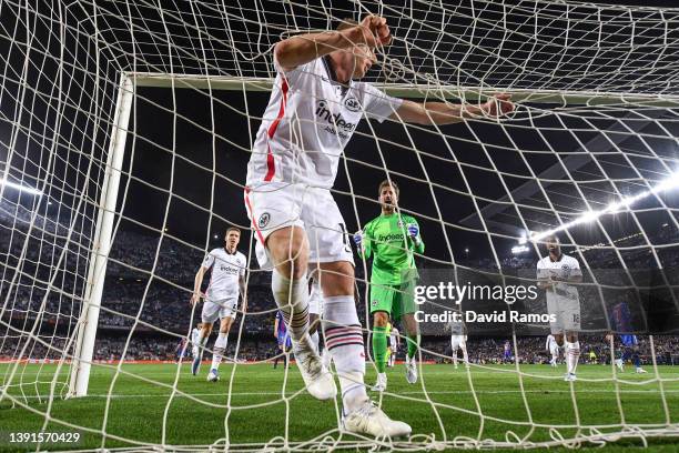 Eintracht Frankfurt players celebrate with his team mate Martin Hinteregger of Eintracht Frankfurt after he cleared the ball over the goal line...