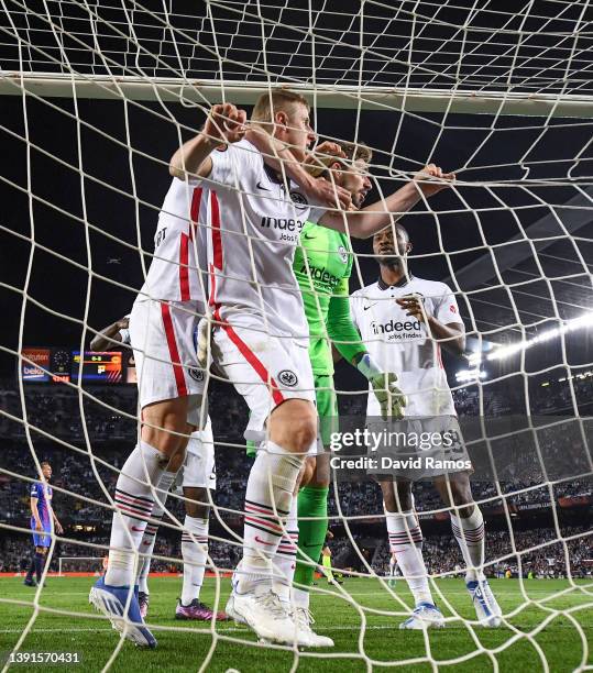 Eintracht Frankfurt players celebrate with his team mate Martin Hinteregger of Eintracht Frankfurt after he cleared the ball over the goal line...