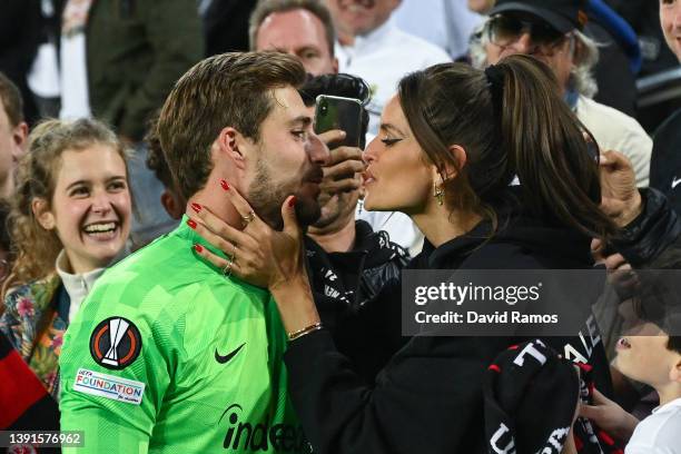 Kevin Trapp of Eintracht Frankfurt kisses his wife Izabel Goulart after the UEFA Europa League Quarter Final Leg Two match between FC Barcelona and...