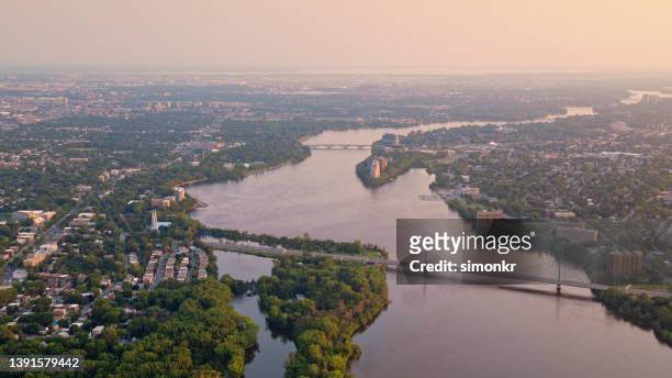 riviere des prairies and papineau-leblanc bridge - quebec aerial stock pictures, royalty-free photos & images