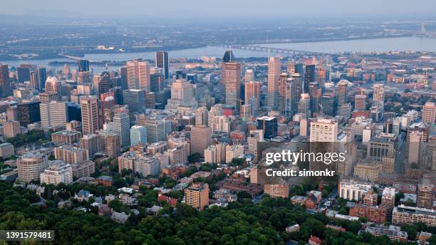 downtown montreal with saint lawrence river - montreal stock pictures, royalty-free photos & images